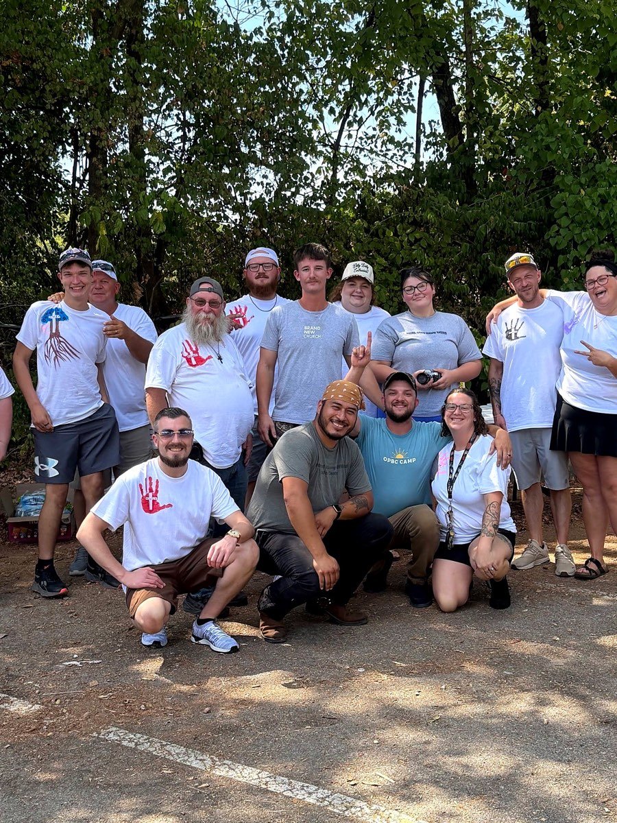 The FSWCF outreach team smiling together in matching handprint t-shirts